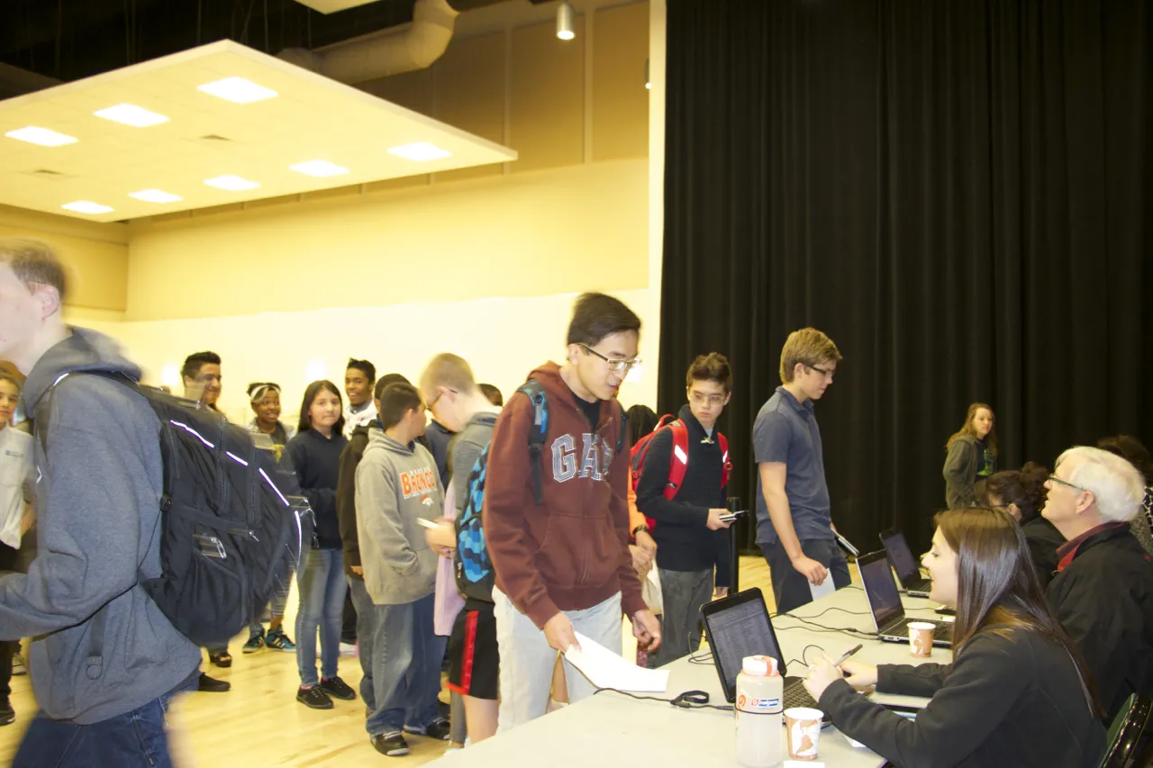 People checking into the 2015 Olympiad